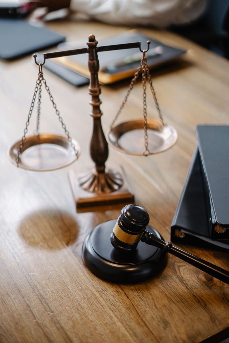 Scales of justice and a gavel on an attorney's desk